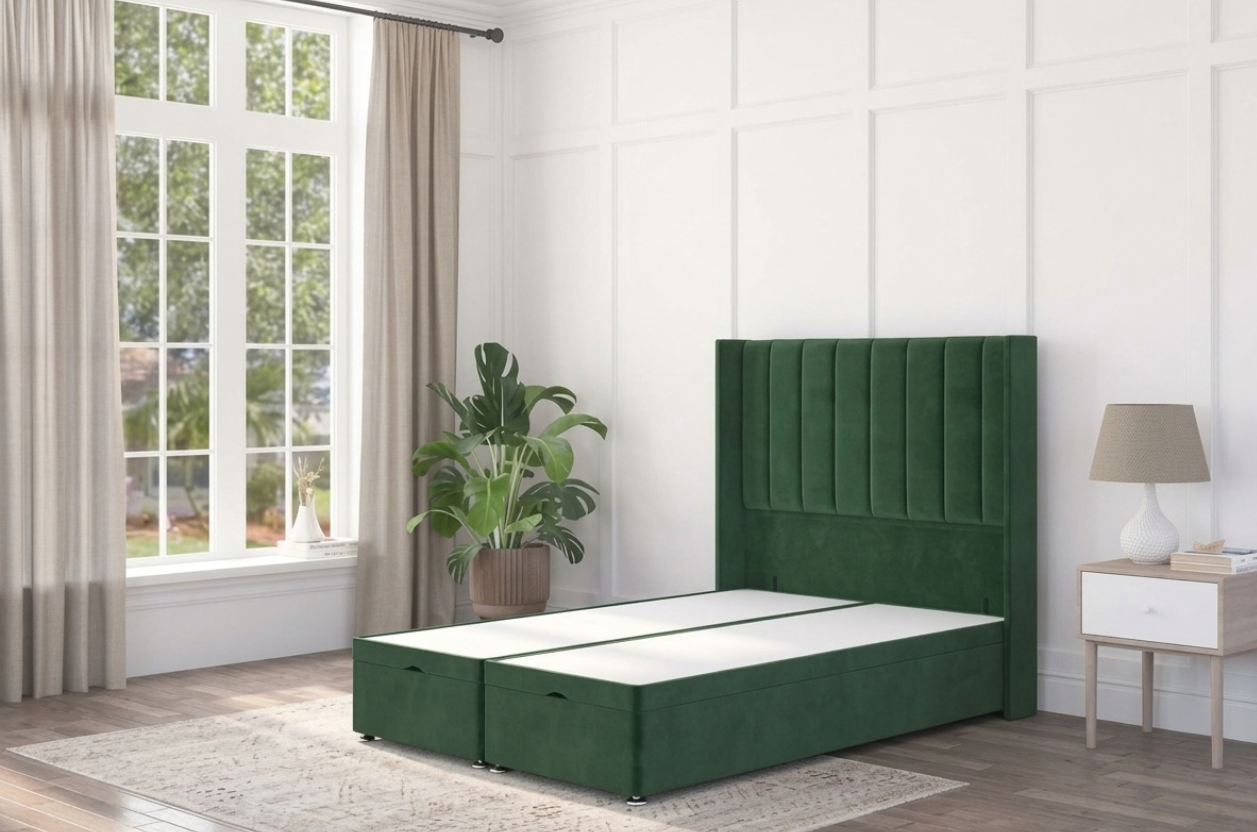 A green ottoman bed base with a stylish wingback headboard, situated in a modern interior.